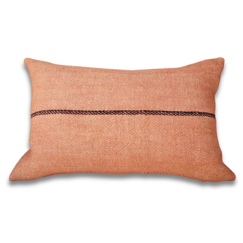 Lumbar cushion, The Dyed Collection, antique handspun hemp, 4-shaft twill weave, uniform coral overdye — warm terracotta tone, single dark stripe at center, Transylvania